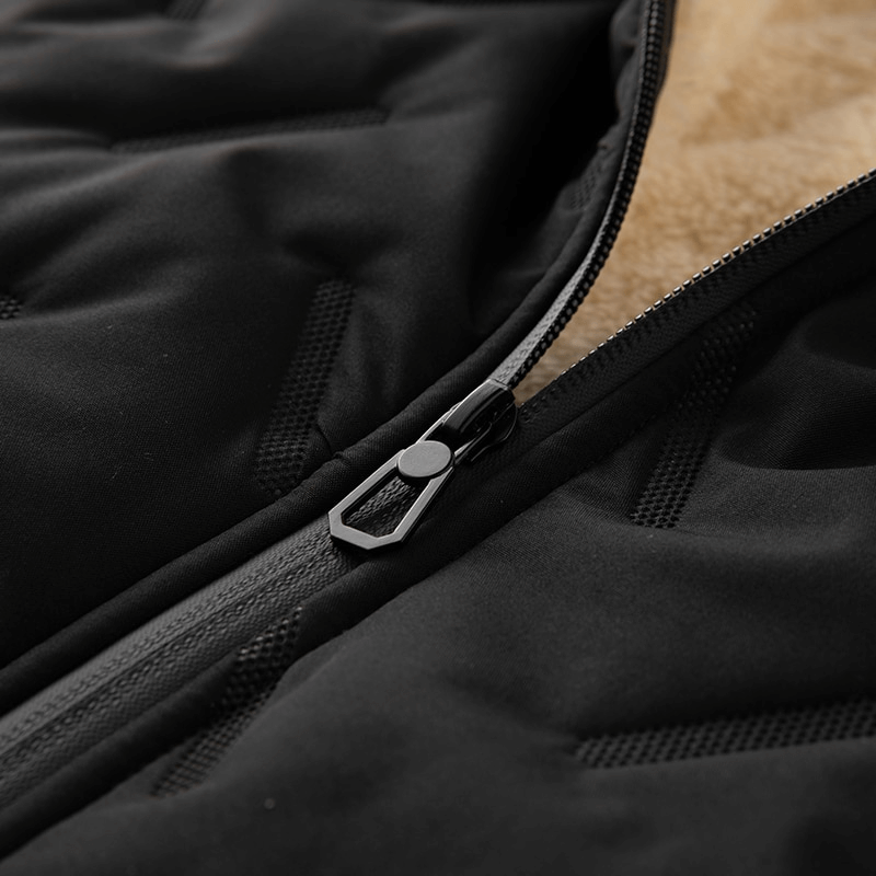 Close-up of black lambswool vest with stand collar, showing zipper and soft lining for warmth and casual style.